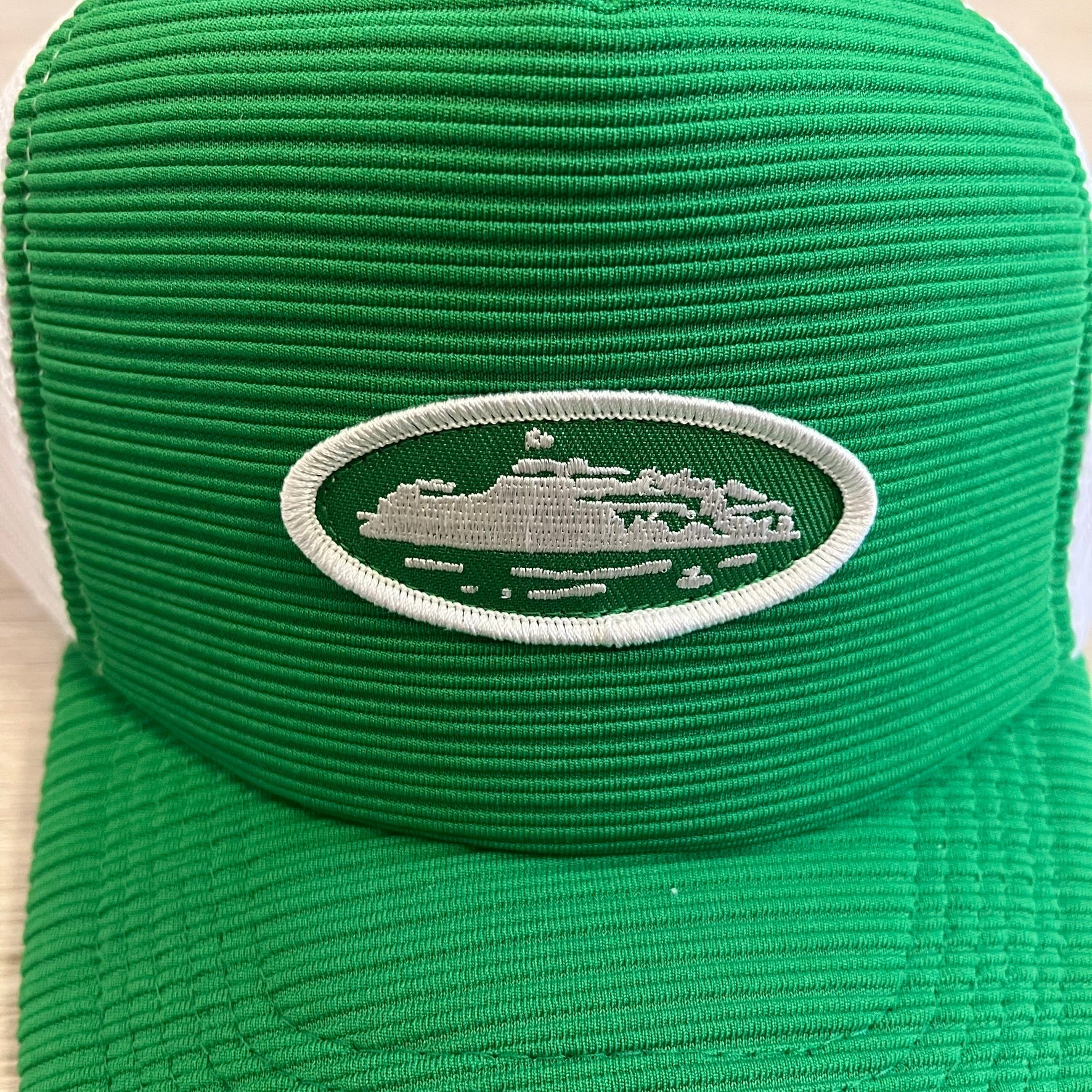 corteiz short peak trucker hat