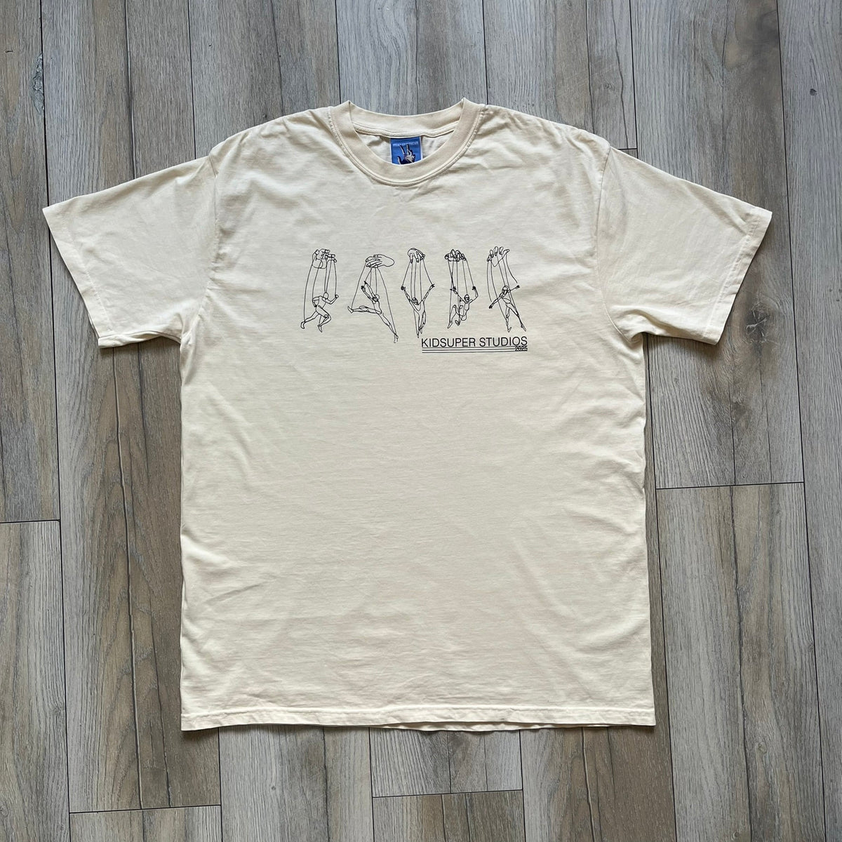 KidSuper Studios SS25 "String Puppets'" Cream Tee
